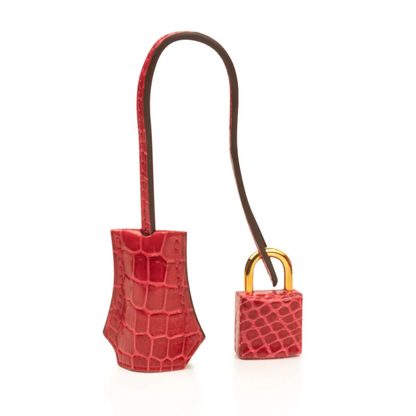 Vivid Glossy Fire Red Fine Scaled Compact Trapezoid Hand Tote With Luminous Golden Twist Lock Hardware And Matching Textured Suspended Metal Padlock Charm